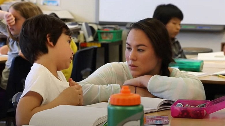 COE UOTeach student teaching children in a classroom