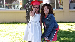 Jennifer Christmas and a younger individual posing for camera